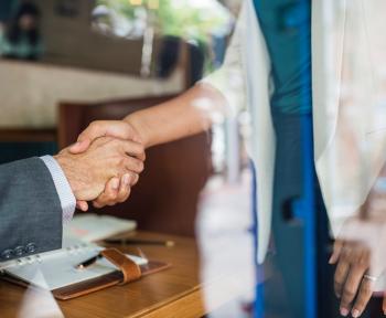 Two people shaking hands