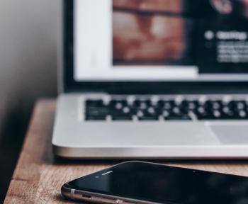 Laptop and phone on a desk