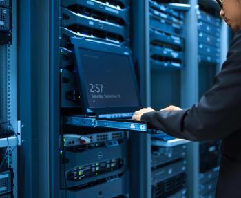 Man typing in a data center